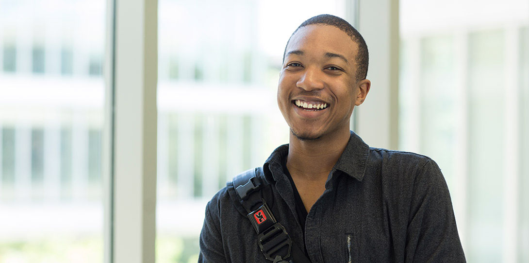 A smiling U I C student.